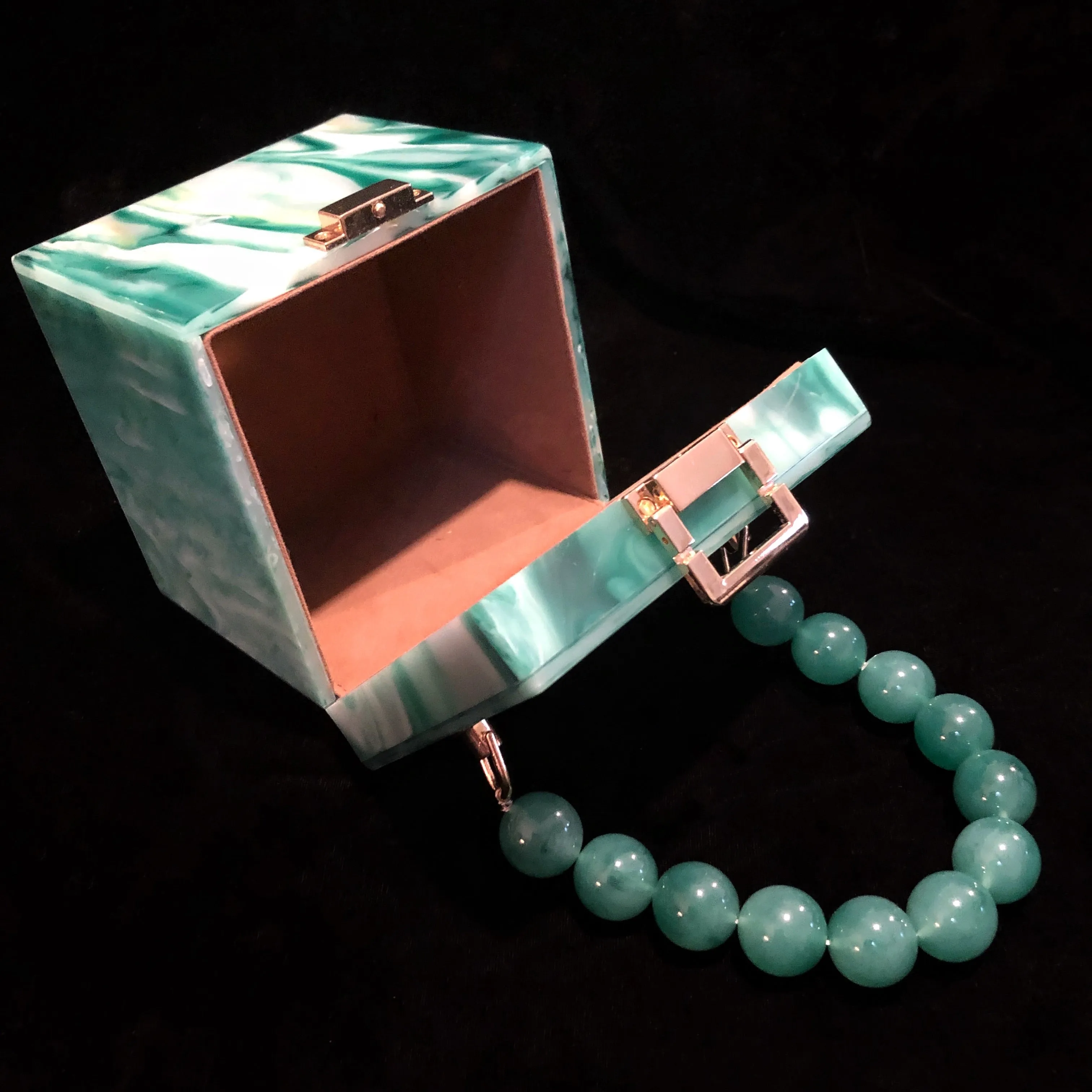 A MARBLED PERSPEX CUBE BAG