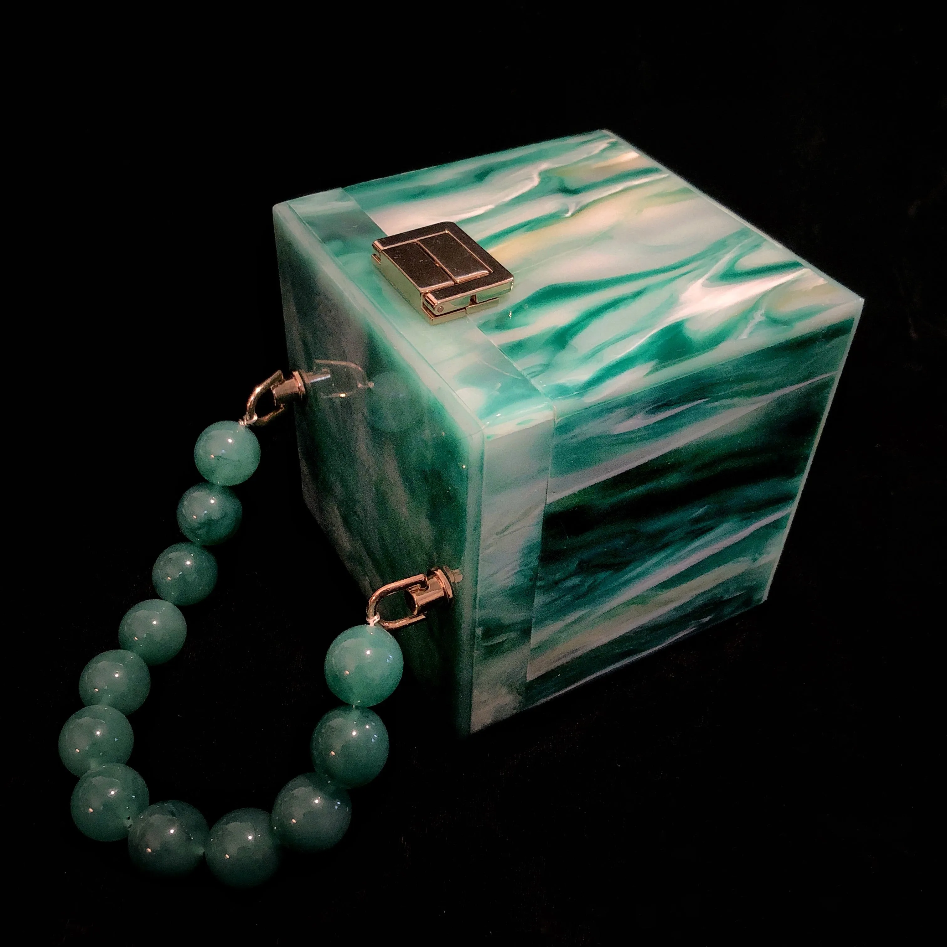 A MARBLED PERSPEX CUBE BAG