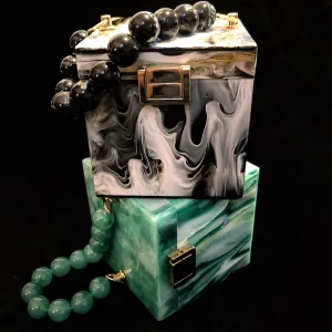 A MARBLED PERSPEX CUBE BAG