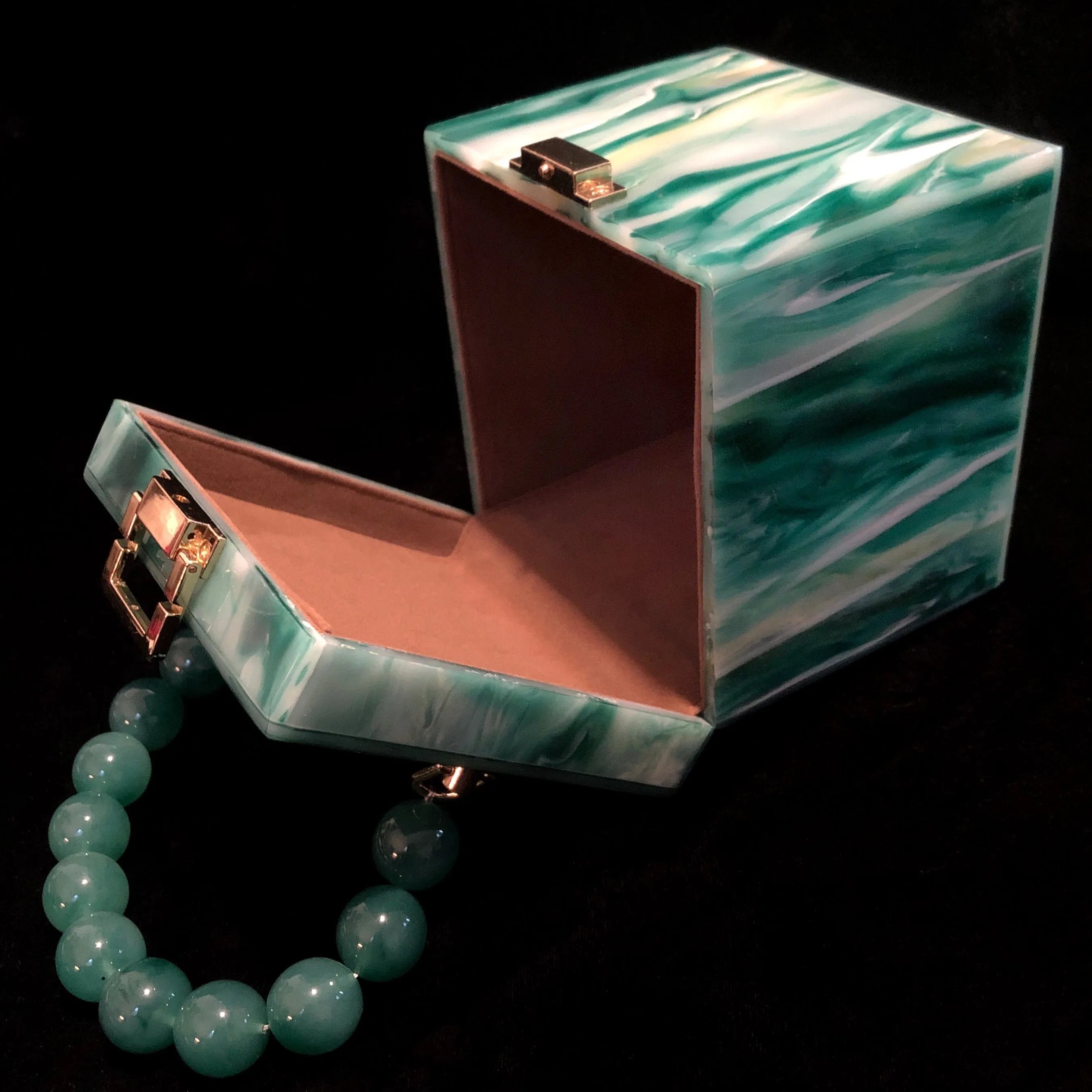 A MARBLED PERSPEX CUBE BAG