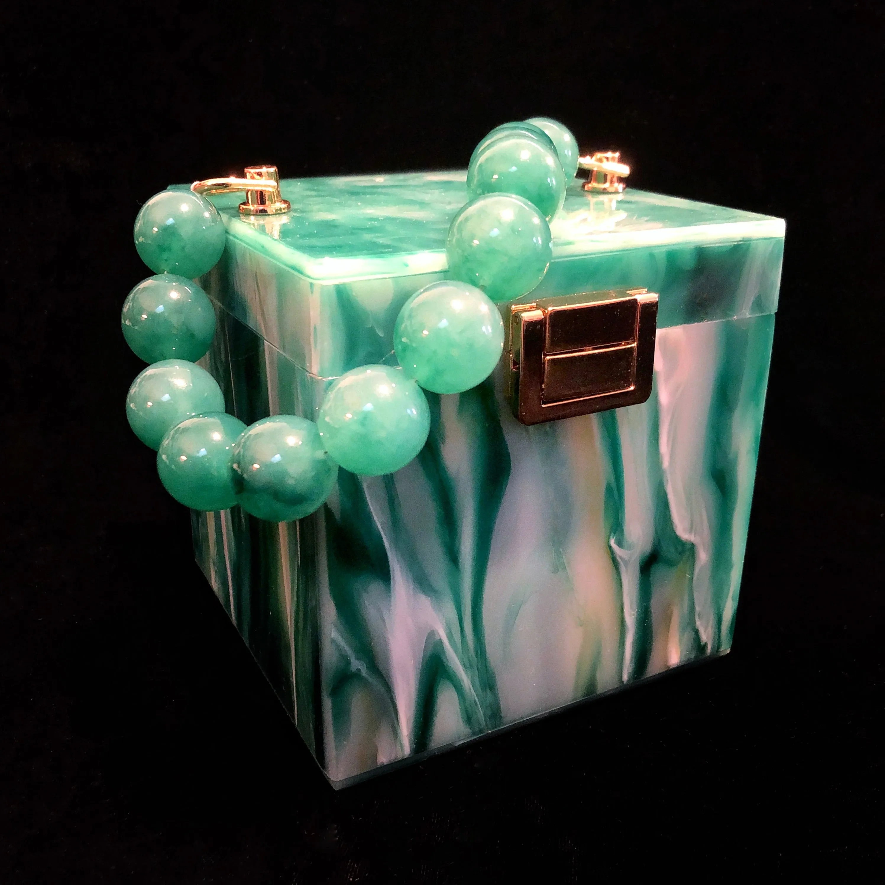 A MARBLED PERSPEX CUBE BAG
