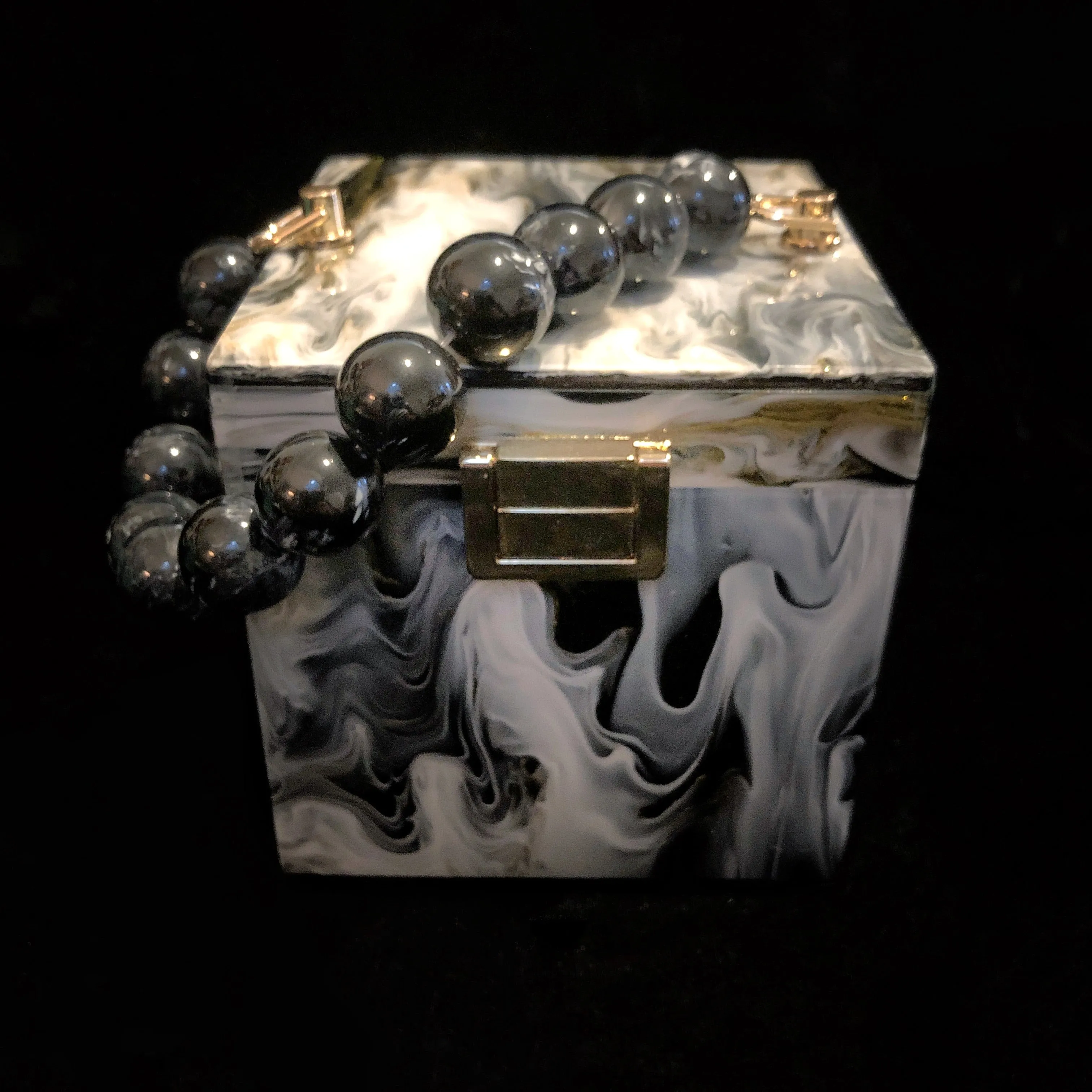 A MARBLED PERSPEX CUBE BAG