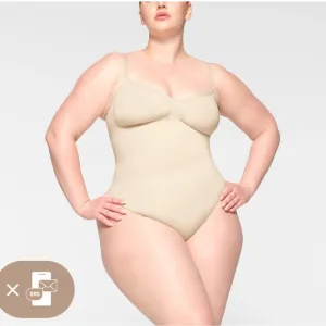SKIMS Seamless Thong Sculpt Bodysuit in a light nude color Sz 2X-3X