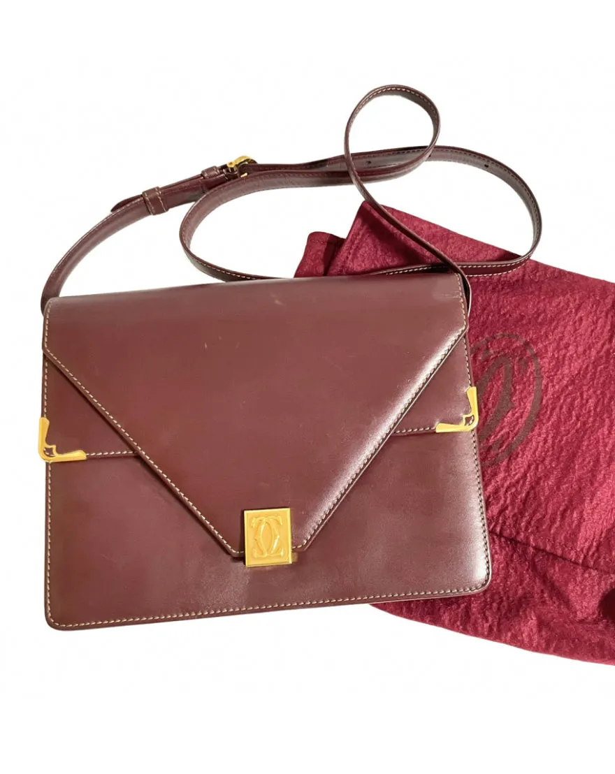 Vintage Cartier double flap envelope shoulder bag with gold-tone logo charm closure and frames. Classic purse from Must de Cartier. 0408172
